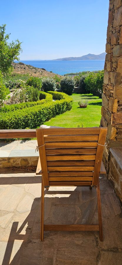 Patio chair overlooking garden and sea