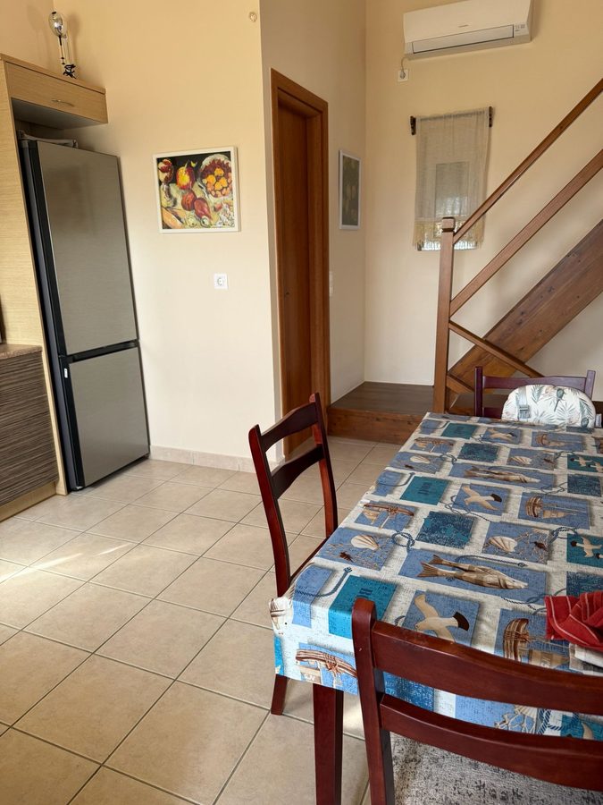 Kitchen and dining area with staircase